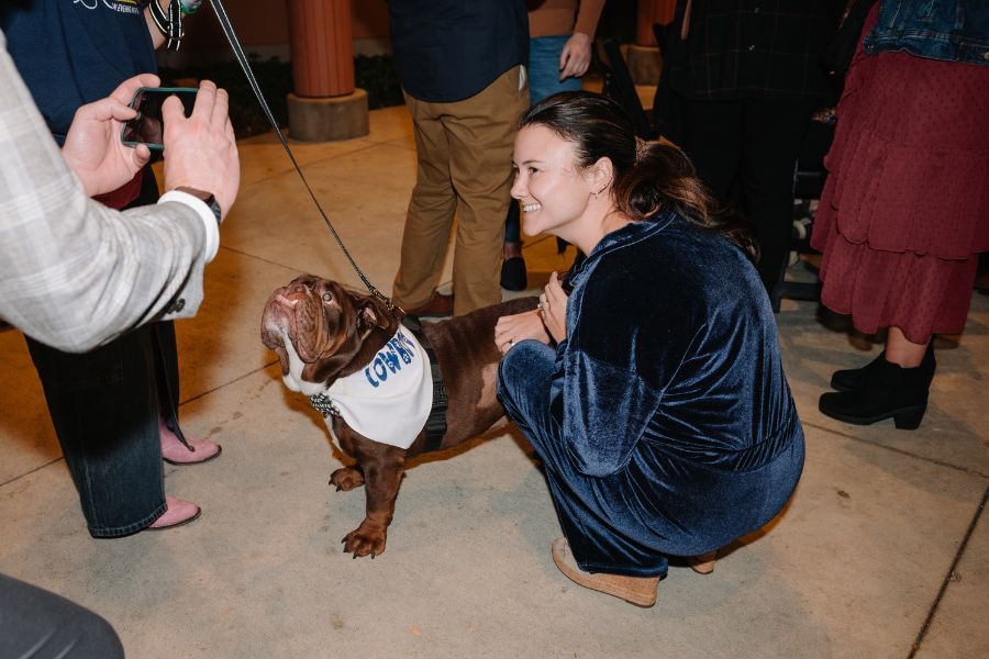 Cowboy The Bulldog Who Redefined Therapy Dogs with Paws & Think posing for photo with maddy